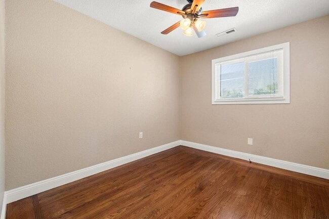 Building Photo - Welcome to this stunning 4-bedroom, 2-bath...