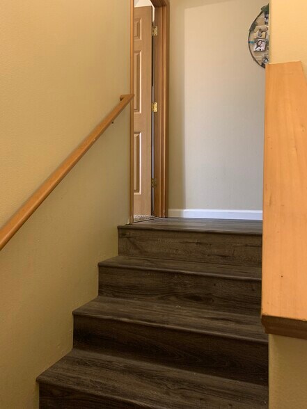 Top of stairway left to Primary Bedroom - 206 E Illinois St