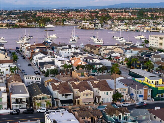 Building Photo - "Coastal Tommy Bahama at 208 East Balboa: Fully Furnished 3-Bed Sanctuary with Rooftop Deck