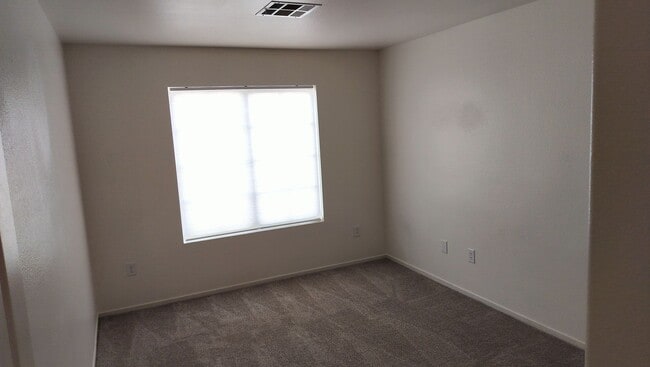 Building Photo - Townhome with Loft + Two Bedrooms/Baths - Designed for Comfort in Gated Community