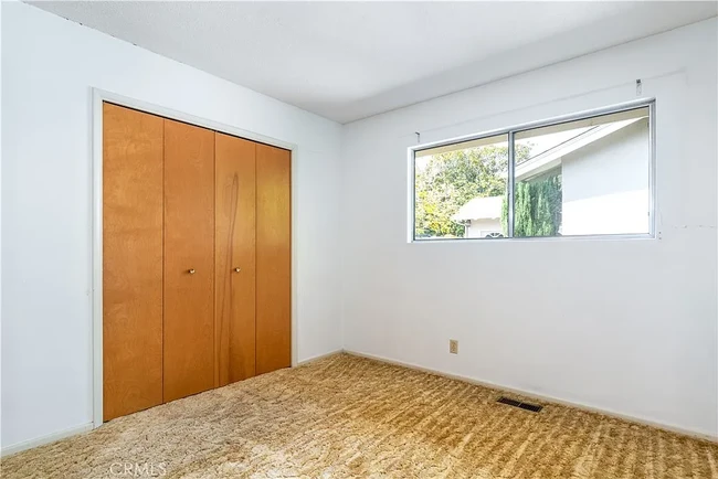 View of Bedroom 2 before new floors - 679 Rancho Dr