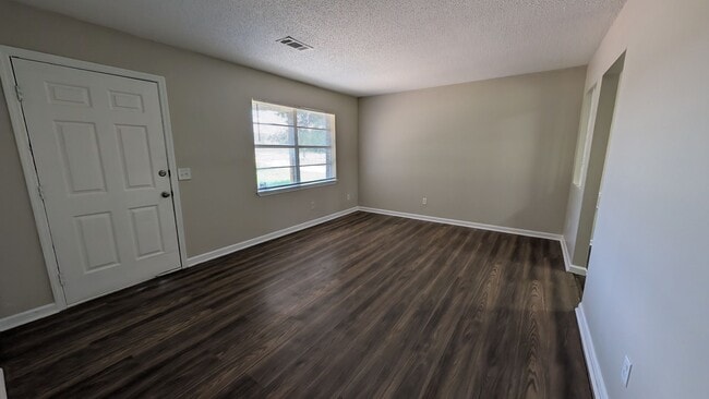 Building Photo - Fenced Yard, Lots of Light, Hard Floors Throughout
