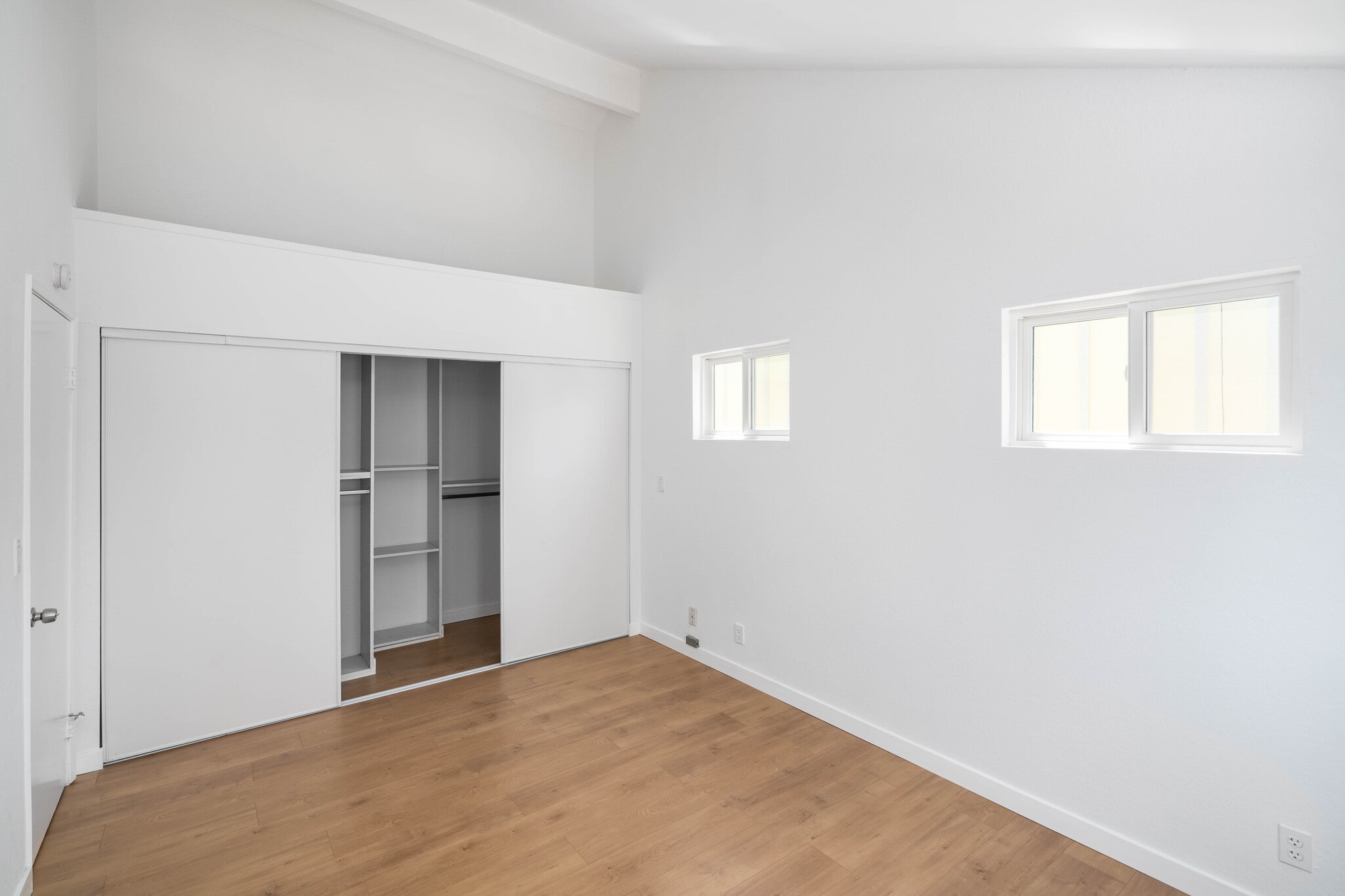 Primary bedroom with built-in closet organizers. - 744 N Dillon St