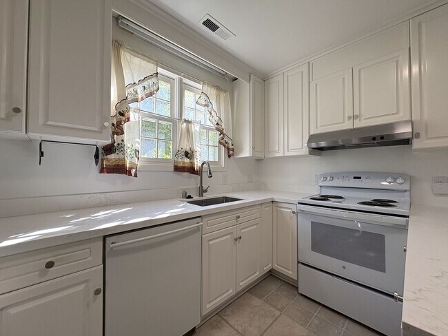 Building Photo - Charming Updated 4BR Home on Prime Corner ...