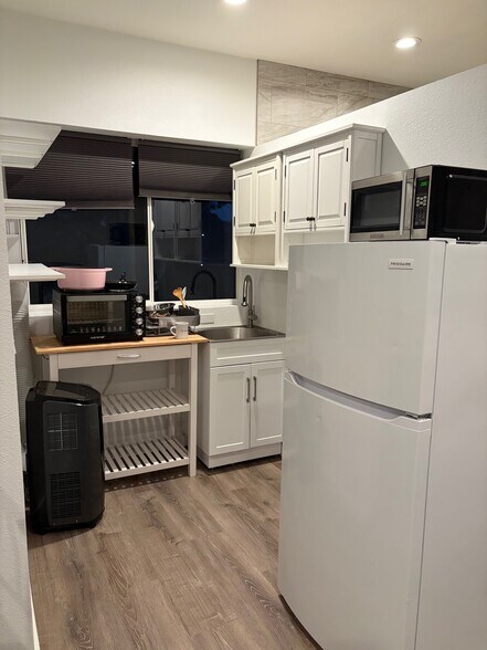 Fridge, microwave, convection oven fits a pizza or casserole, 2 burners on top, shelves for pantry - 136 Farallon Dr