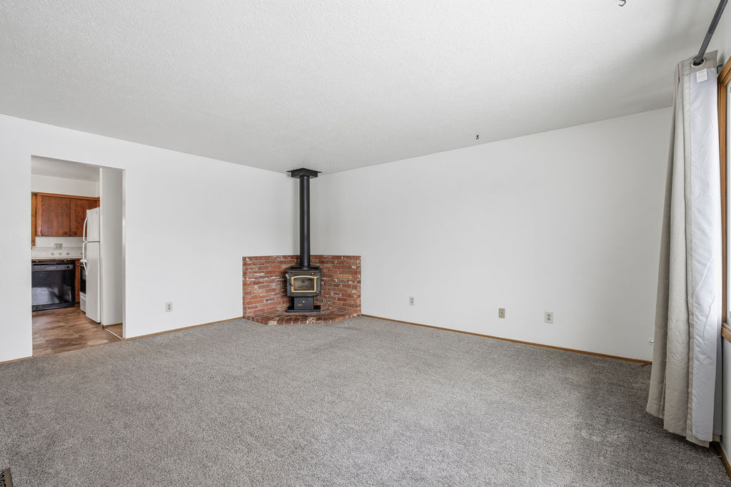 Wood Stove in Living Room - 12202 E 10th Ave
