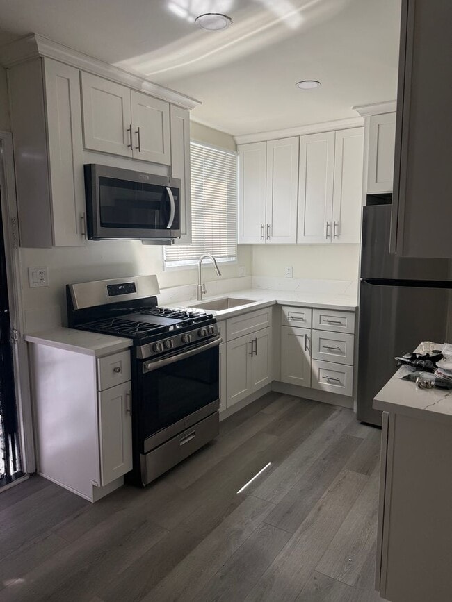 Building Photo - FOR RENT — COMPLETELY REMODELED Apartment