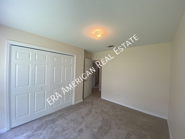 Building Photo - 7468 Woodmont Rd