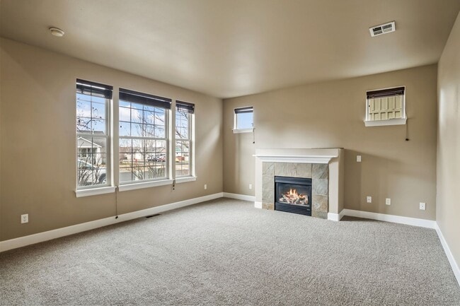 Building Photo - Spacious 4-Bedroom Home with New Paint & Carpet, Fenced Yard