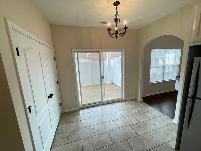 Building Photo - White House townhome- lawn care included, 1 car garage!