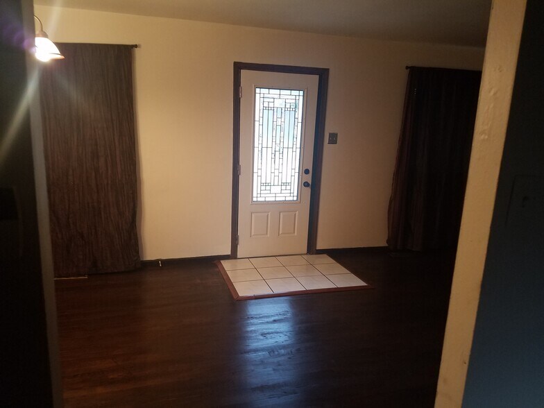 Front door has decorative security glass - 1820 Bluebird Dr