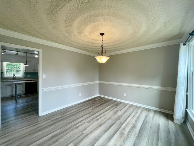 Building Photo - Available NOW! A 4-6 Bedroom Home! Attache...