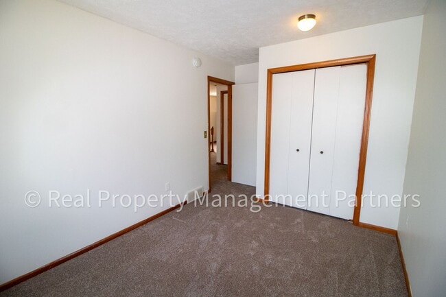 Building Photo - 2-Bed, 1-Bath Upper Unit with Garage & Porch – Steps from Paul Henry Trail