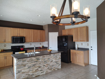 Kitchen with stacked rock island - 3544 Plano Vista Rd NE