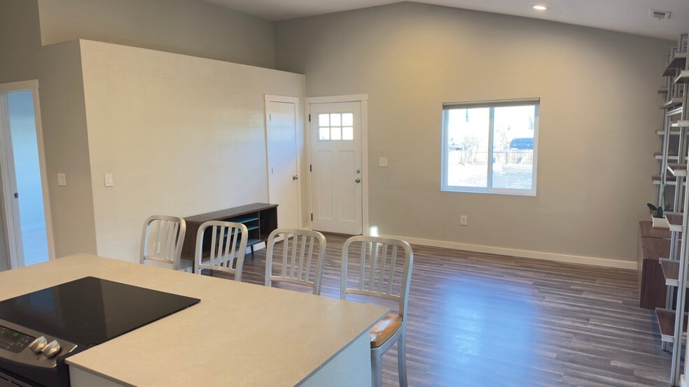 View from the kitchen to the front door and living area. - 521 Perry St
