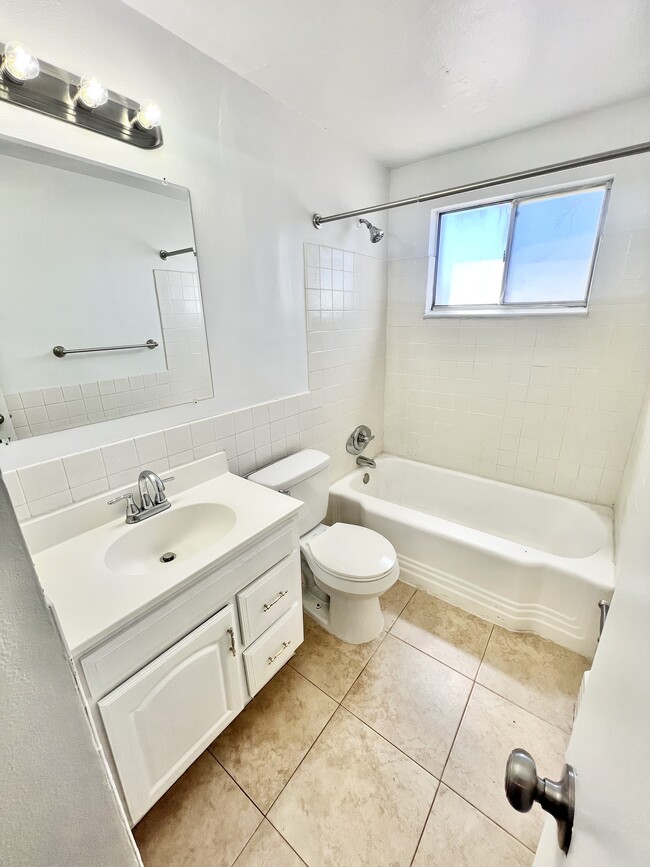 Experience everyday luxury in this bright and airy modern bathroom. - Westland Apartments