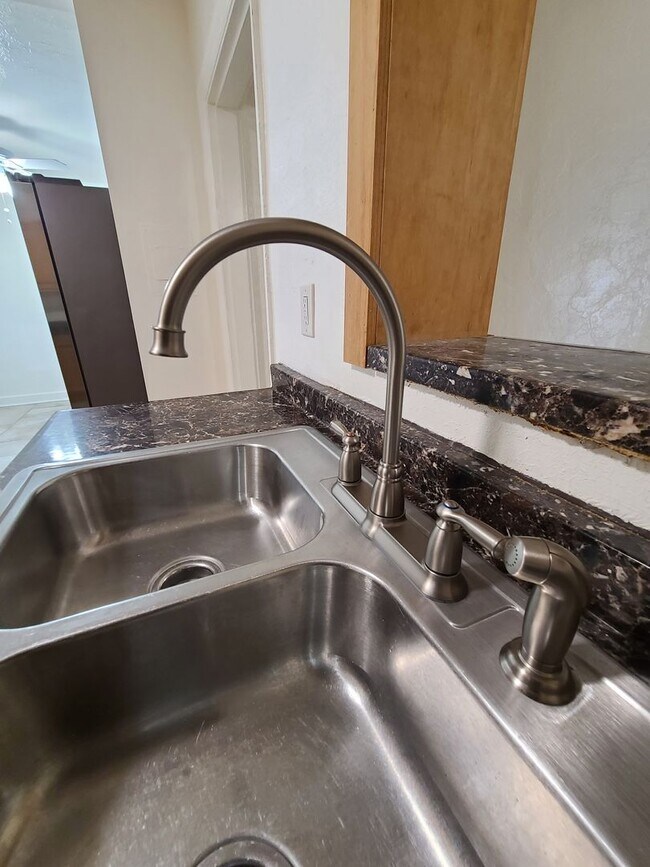 Building Photo - Stunning Corner-Lot Rental: 4BR/2BA with Courtyard