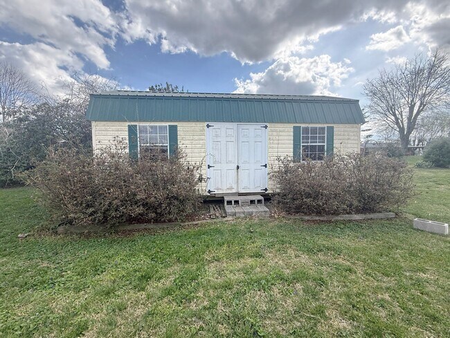 Building Photo - Spacious 3-Bedroom Home with Huge Yard, Covered Porches & Storage Building