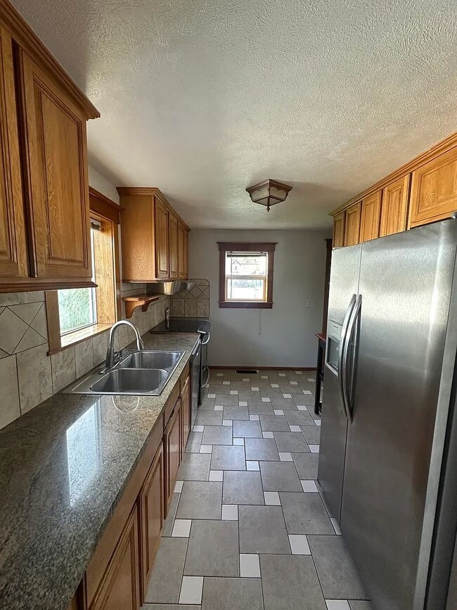 Building Photo - Ideally Located and Updated 4 Bed 2 Bath Fully-Fenced Home w/ Detached Garage/Shop!