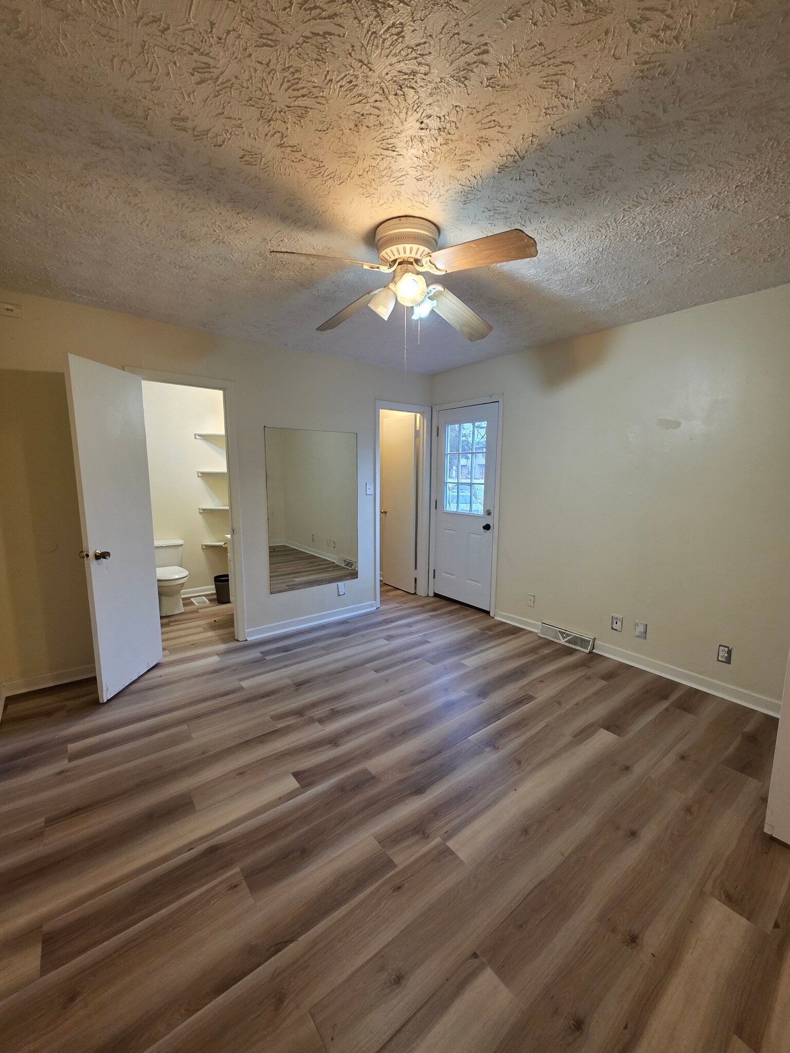 Master bedroom with attached bathroom and walk in closet - 9102 Woodpark Ln