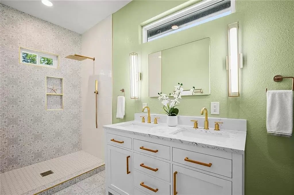 High end gold finishes to compliment the custom patterned tiling in this master ensuite. - 5402 Duval St