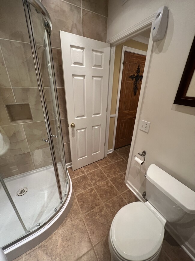 Bathroom with closet, shower only, and vanity. - 3617 Sunset Rdg