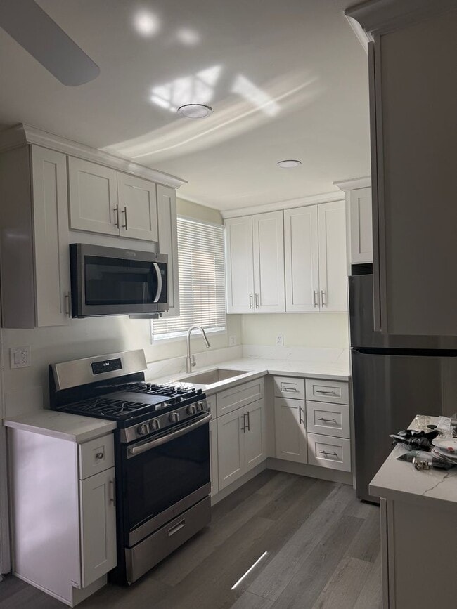 Building Photo - FOR RENT — COMPLETELY REMODELED Apartment