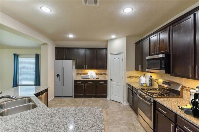 Building Photo - One-and-a-half story, 4 bedroom home - Available early June!