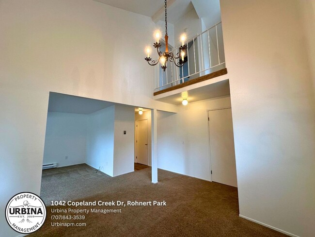 Building Photo - Charming 2-Bed, 1.5-Bath End-Unit Condo in...