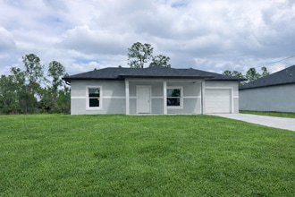 Building Photo - NEW CONSTRUCTION- Modern 1 Bd / 1Ba / 1g Home in Lehigh Acres