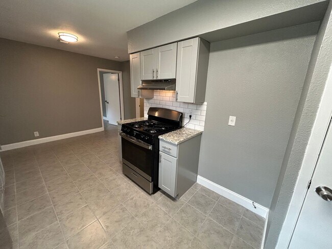 Building Photo - *COMING SOON* Open-Concept 3BD/2BA with Cozy Fireplace & Modern Stainless Kitchen!