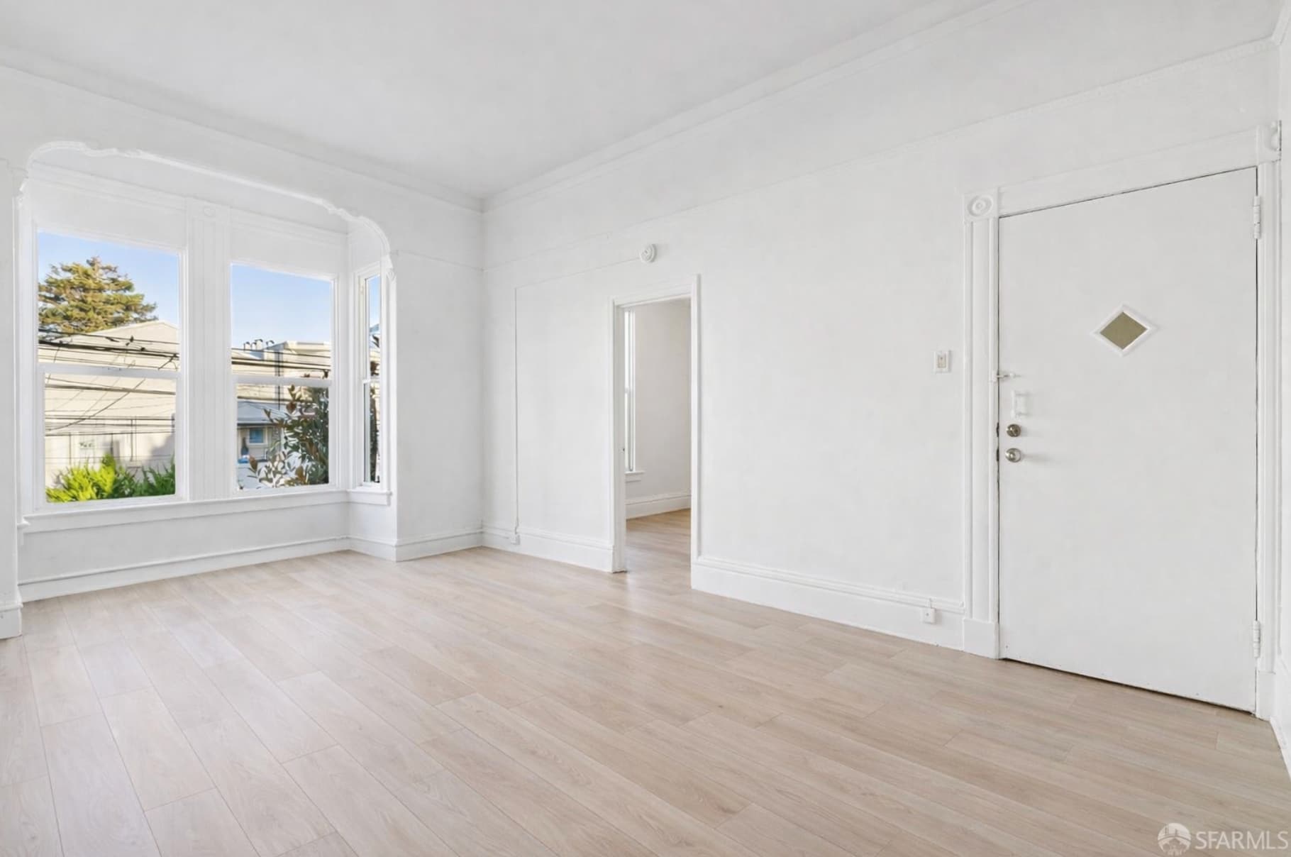 Expansive living room with high ceilings and new luxury vinyl floors - 1330 Alabama St