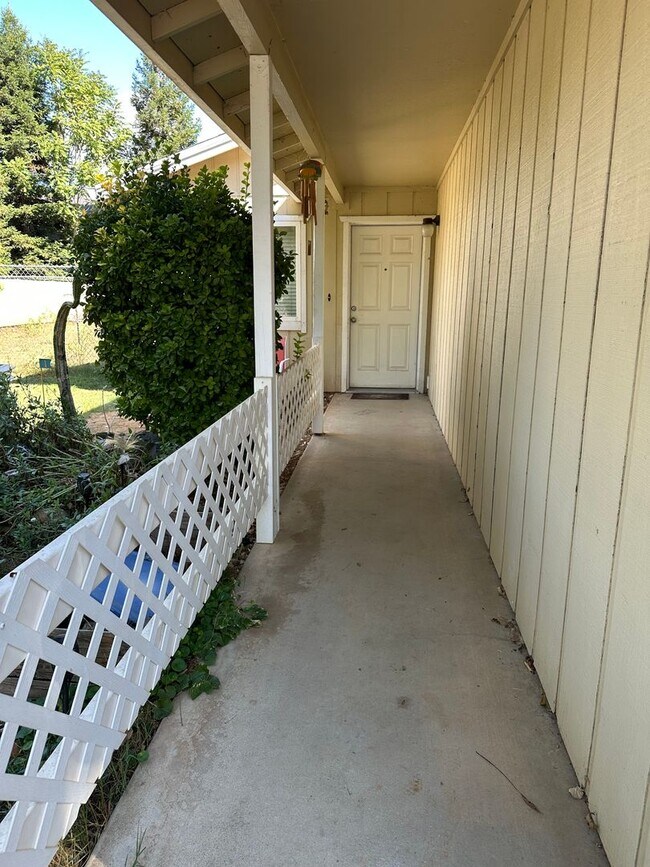 Building Photo - Charming Redding Home with Fireplace & Vau...
