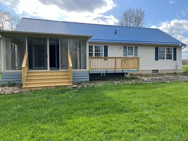 Back of house, sunroom and deck - 2546 OH-60