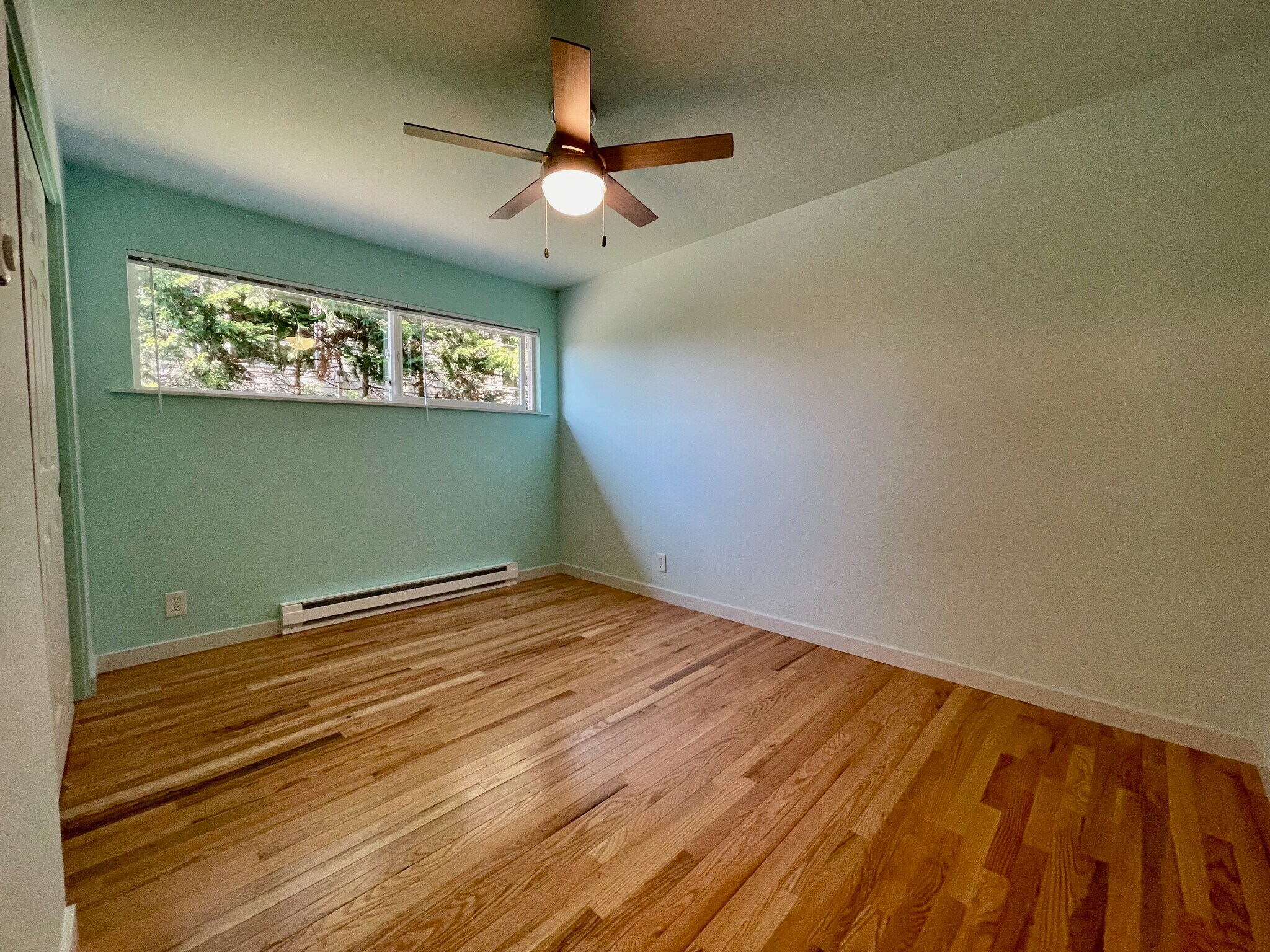 Spacious bedroom (picture is from similar apartment one floor up. Colors may vary) - 2801 14th Ave W