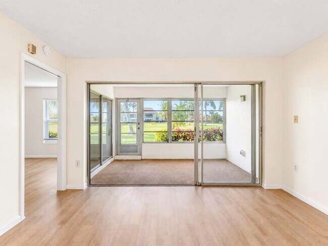 Building Photo - AVAILABLE NOW! Beautifully Renovated First-Floor Condo with Peaceful Screened Lanai