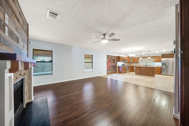 Building Photo - Sign your lease and receive a FREE 50" TV!!!  "Spacious 4-Bedroom Retreat with Fireplace in Charm...