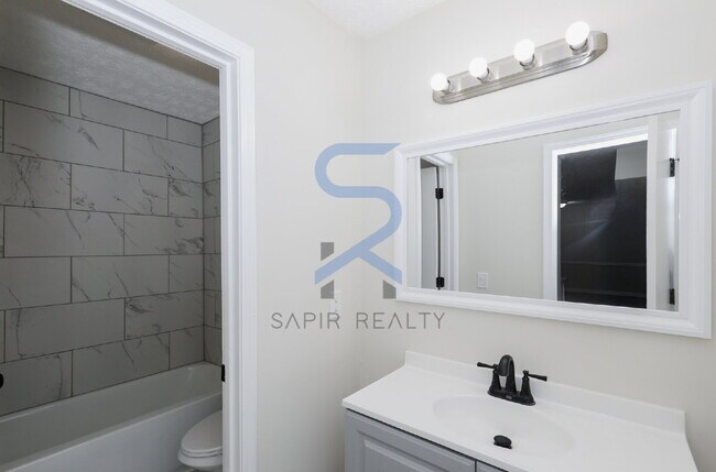 Building Photo - Move in before December 15th and choose your reward: a $250 Amazon Gift Card or a 55" Smart TV!