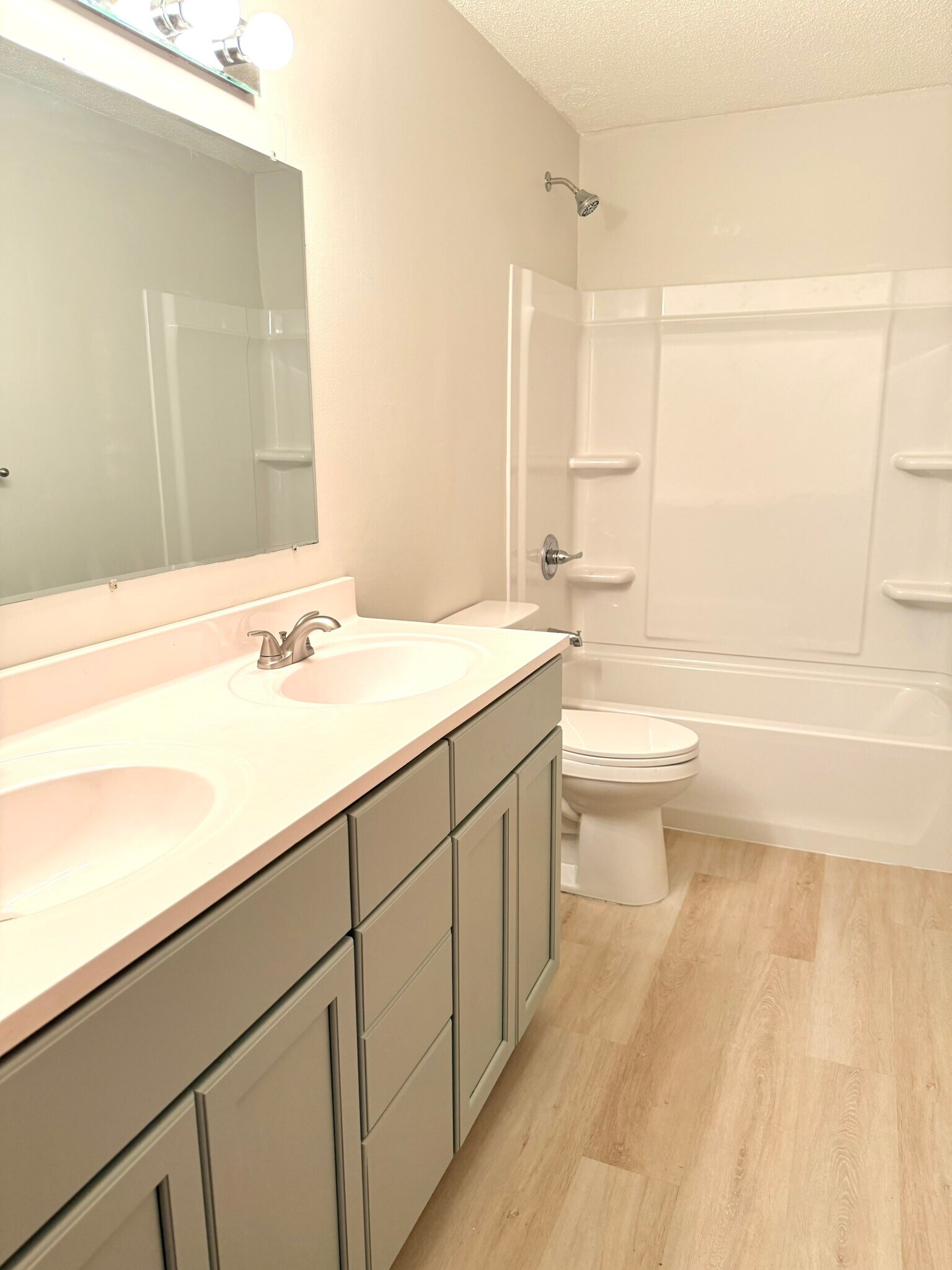 Remodeled bathroom with double sink - 6531 Channel Rd NE