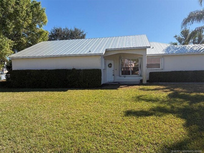 Building Photo - 3486 SW Pindo Palm Ln