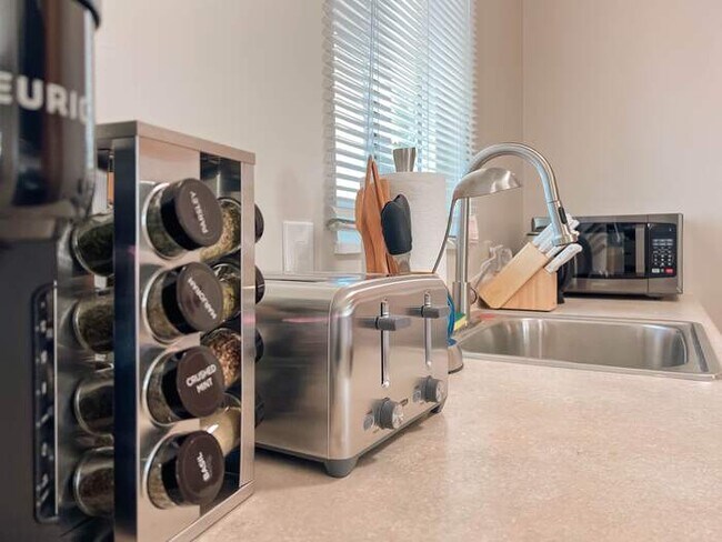 Building Photo - Cozy 2BR Home with Bright Interior & Relaxing Patio