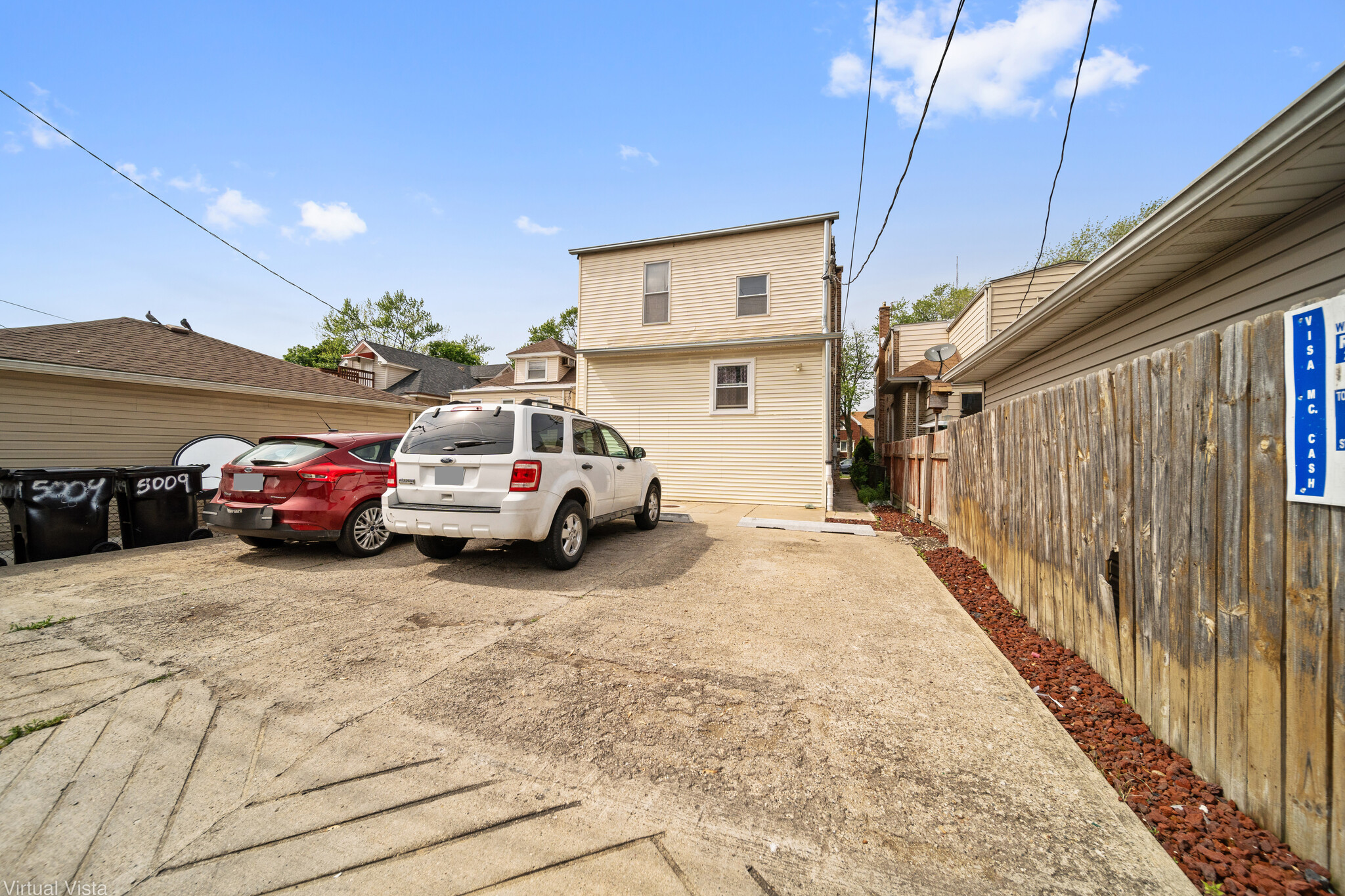 guaranteed parking space in back of buildiner - 5009 W Wellington Ave