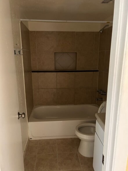 Remodeled bathroom with tile flooring - 115 Lazy Ln