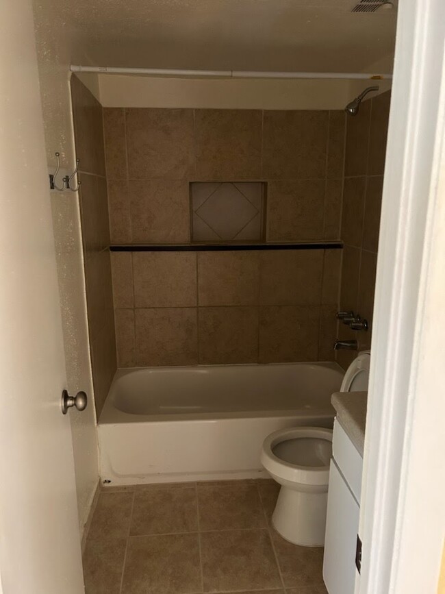 Remodeled bathroom with tile flooring - 115 Lazy Ln