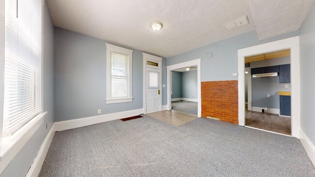 Building Photo - Freshly updated, large garage/small yard