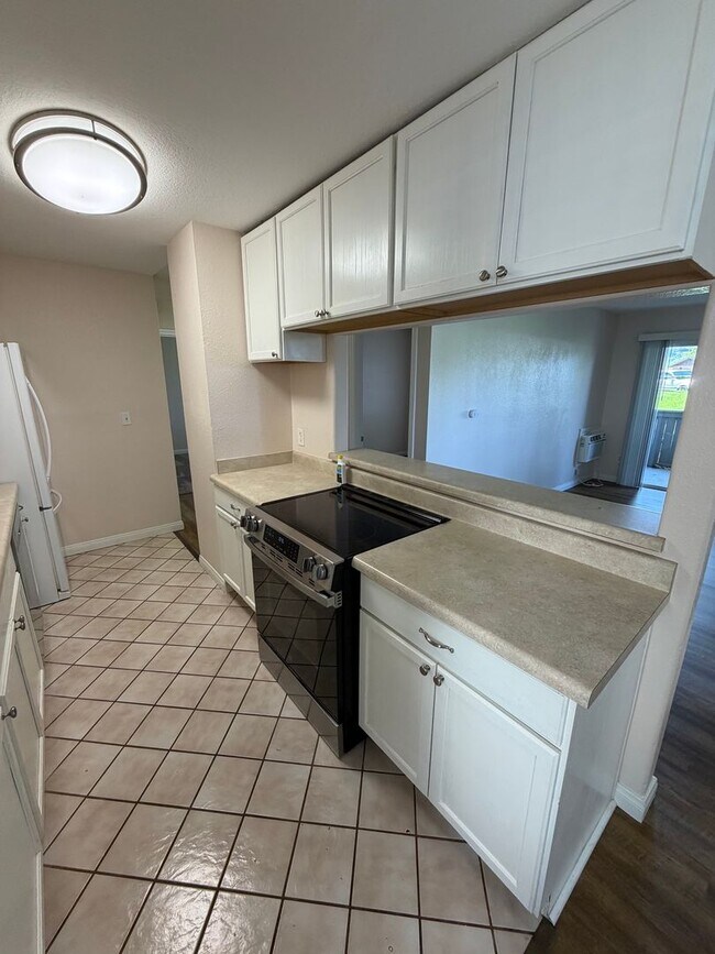 Building Photo - 2BR/1BA Lakeside ground floor condo with 1 car detached garage, 1 uncovered parking space & commu...