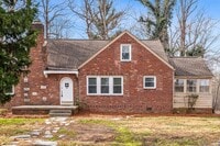 Building Photo - SW, Large Brick Two Bedroom PLUS Two Sun-Rooms, Hardwoods, LR & Separate DR, Fire Place!