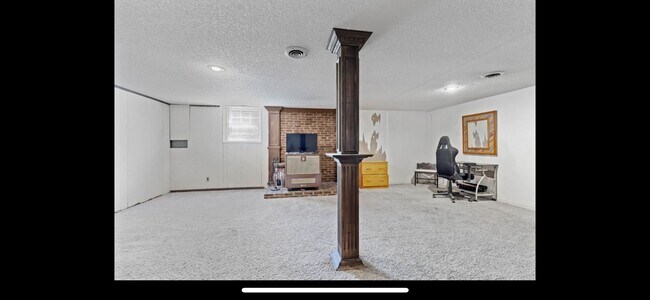 Matching laminate flooring now in this room. - 1820 Whispering Hills Trl