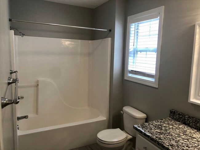 guest bathroom with tub - 230 Heritage Ln