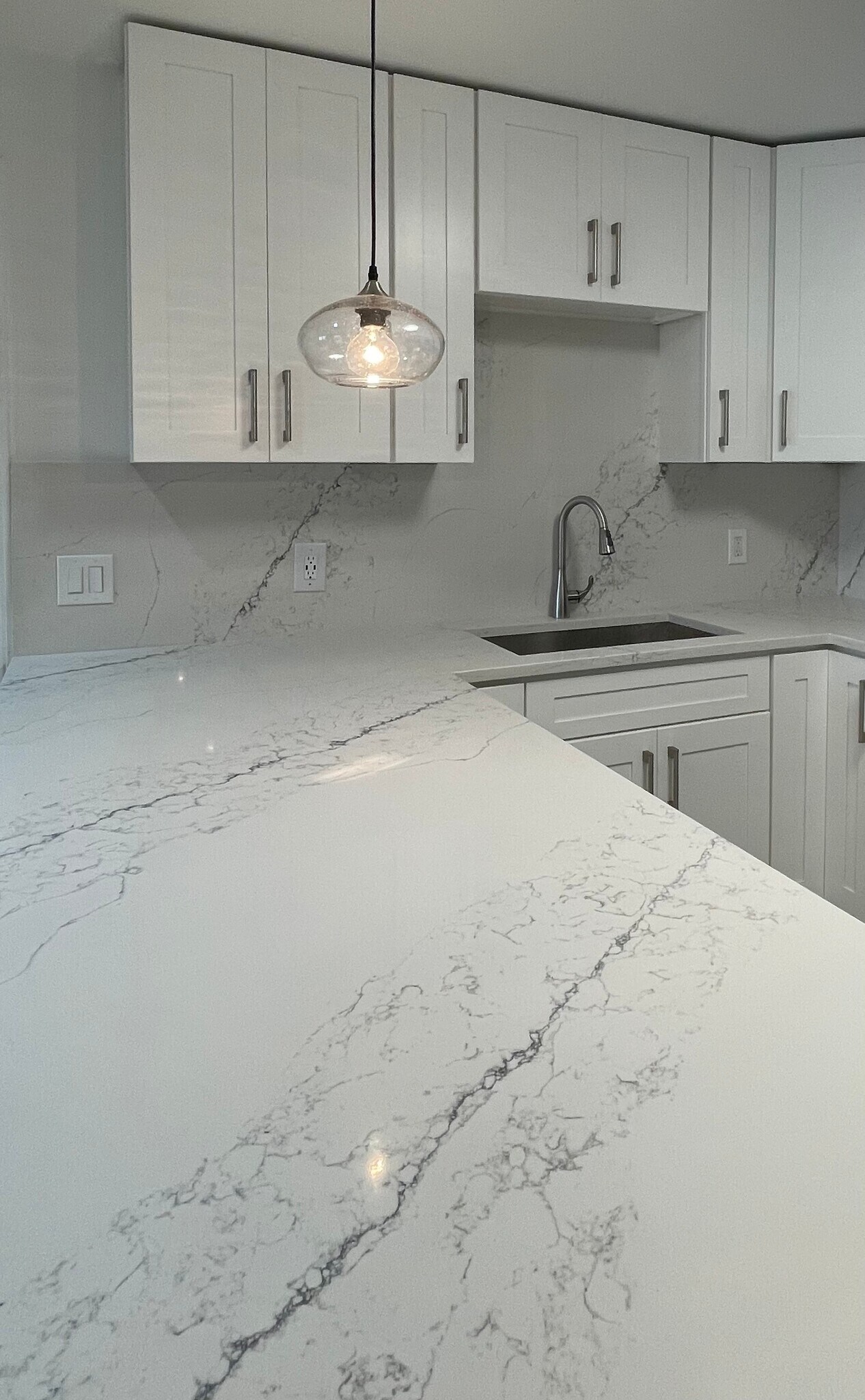 White quartz with gray veining - Mariner's Landing Apartments